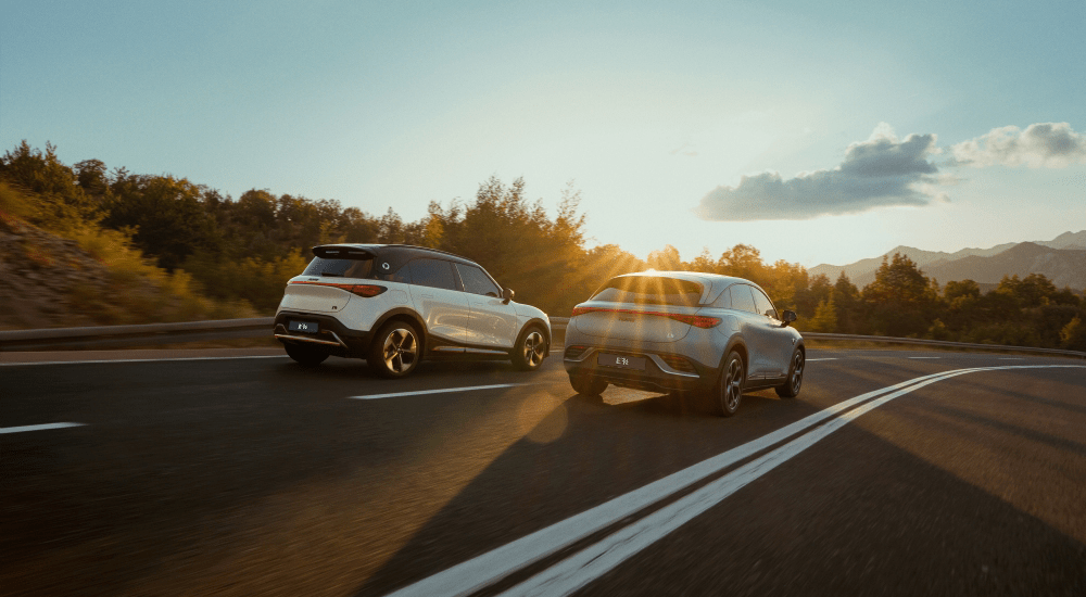 Two cars driving side by side